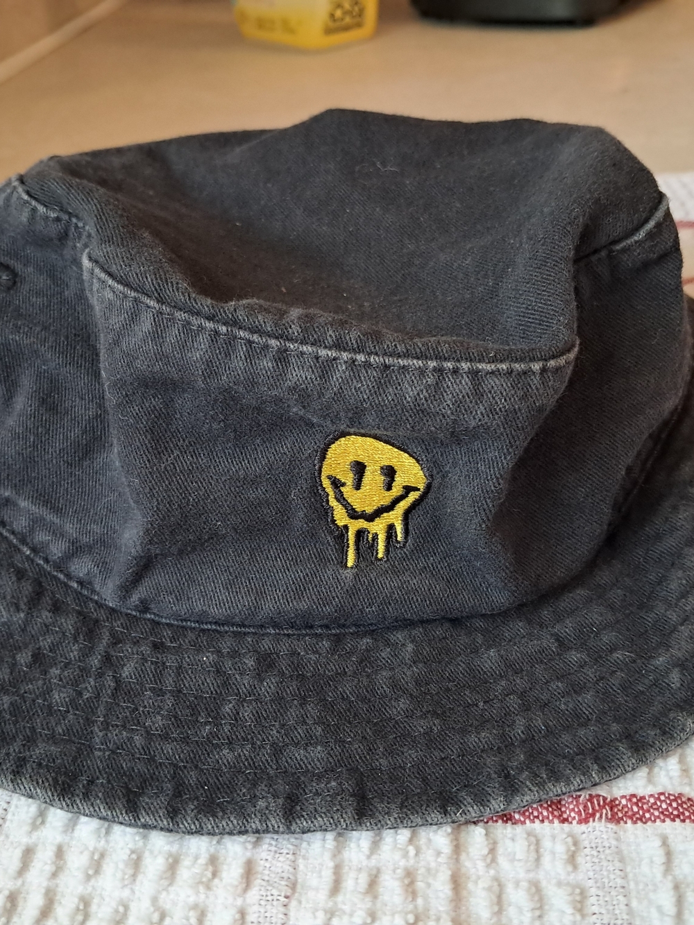 Artist Collective Melting Smiley Face Bucket Hat Black